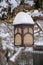 Decorative outdoor lantern in snow