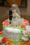 Decorative pair of newlyweds on top of a wedding cake