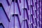 Decorative parts of metal gates. Metal purple fence. Texture of