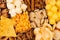 Decorative pattern of crunchy spicy snacks, top view, closeup. Fast food background.