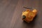 Decorative pear pumpkin on wood table