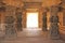 Decorative pillars from black basalt in mandappa or Hall. Hazara Rama Temple Hampi, Karnataka. Stone carving ancient. Indian God