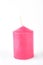 Decorative pink candle on white background.