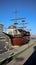 decorative pirate boat, vintage ship in Skopje, restaurant on the Vardar River on bright summer day with clear blue sky