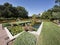 Decorative pool with water plants and glass sculptures in a luxurious garden