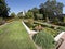 Decorative pool with water plants and glass sculptures in a luxurious garden