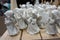 Decorative porcelain figures of little angels at Christmas market. Traditional market with handmade souvenirs