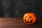 Decorative pumpkin for sweets for Halloween on a dark background