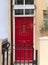 Decorative red door to the London house, typical architectural feature, London, United Kingdom