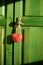 Decorative red heart hanging on wooden wardrobe knob