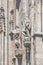 Decorative Religious figure at facade of the Cathedral of Milano, Milan, Italy