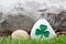 Decorative rock with a painted green shamrock