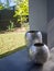 Decorative shiny aluminum pots on patio