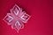 decorative snowflake on a colored background. viva magenta. background for decoration for the New Year and Christmas.