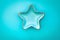 Decorative star-shaped bowl over blue background