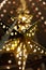 Decorative star-shaped lanterns suspended from the ceiling. Christmas garland