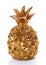 Decorative statuette of golden pineapple on white background