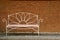 decorative Steel Bench with Brick Wall Background