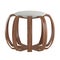 Decorative stool with rounded wooden legs and a round padded seat on an isolated background. 3D rendering