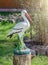Decorative stork in a garden.