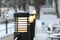 Decorative street lighting in a warm shade, modern lanterns on a metal black border