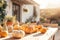 Decorative striped pumpkins on a wooden table on sunny autumn day. Thanksgiving decoration outdoors. Celebrating traditional