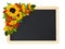 Decorative sunflowers and rowan berries in a beautiful autumn corner arrangement with black chalkboard