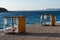 Decorative tables on the sandy shore in Primosten town, Dalmatian Coast, Croatia