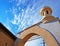 Decorative tower and a blue cloudy sky