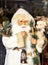 Decorative toy Santa Claus in a white fur coat