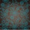 Decorative turquoise flower, brown background