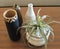 Decorative vases and a potted plant on a table