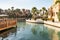 Decorative water channel flowing through the courtyard of the bazaar and shopping mall - Souk Madinat Jumeirah in Dubai city,