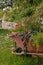 Decorative wheelbarrow planted with flowers and plants