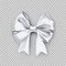 Decorative white bow with ribbon
