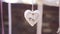 Decorative white heart on the rope as a wedding decor