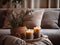 Decorative winter arrangement with fir and candles in cozy home interior, stylish room decor for Christmas holiday