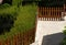 Decorative wooden fence for enclosing greenery.