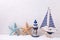 Decorative wooden toys boat , lighthouse and starfish on text