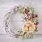 Decorative woven wreath is decorated with flowers and quail eggs.