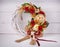 Decorative woven wreath is decorated with flowers and quail eggs.