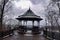 Decorative Wrought iron gazebo and bench in a park