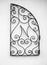 Decorative wrought iron hanging on the white wall. Wrought iron elements of decor