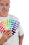 Decorator holding color charts