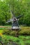 Decorotive miniature Dutch windmill in tulip garden park