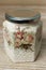 Decoupage decorated closed vintage jar