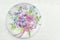 Decoupage decorated plate with flower pattern