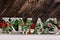 Decoupage decorated XMAS letters on wooden background
