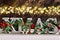 decoupage decorated XMAS letters on wooden background with bokeh effect