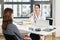 Dedicated doctor listening to her patient during a private consultation